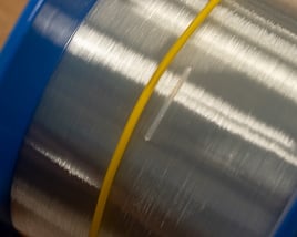 Fiber splice closure sleeve on fiber spool
