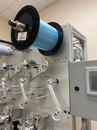Custom fiber spooling in-house for a variety of sizes and purposes of spools